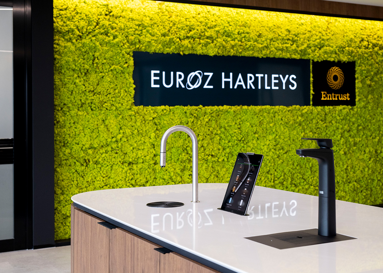 euroz hartley statement green wall and integrated coffee machine on kitchen bench