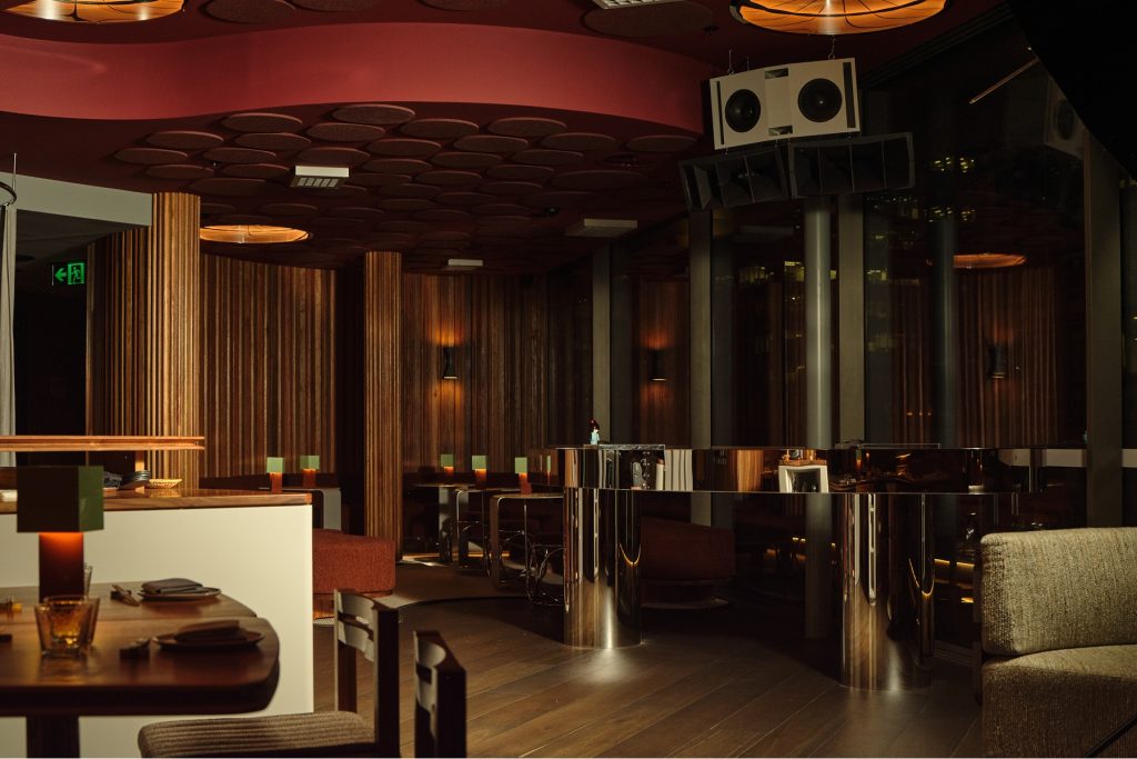 LCI partnered with ESCA Group and architect Matt Darwon to create a state-of-the-art audio visual design for the Joji Bar, a Sydney restaurant and cocktail bar. By overcoming challenges like compact spaces, acoustic limitations, and budget constraints, LCI delivered a bespoke sound system with custom-made speakers, recessed subwoofers, and seamless control integration. The result is a visually stunning, high-performance audio experience for Joji’s nightly DJ sets.